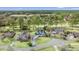 Aerial view of a gray home surrounded by mature landscaping and trees in a lush community at 75 Haig Ct., Georgetown, SC 29440