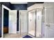 Bathroom including walk in shower with glass doors, wood look floors, and white vanity at 75 Haig Ct., Georgetown, SC 29440