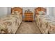 Bright bedroom with twin beds with woven headboards and neutral carpeting at 75 Haig Ct., Georgetown, SC 29440