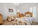 Bright bedroom with twin beds, natural light and woven headboards at 75 Haig Ct., Georgetown, SC 29440