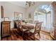Traditional dining room with hardwood floors, a decorative chandelier and lots of natural light at 75 Haig Ct., Georgetown, SC 29440