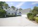 Beautiful single-story home featuring a long drive, well-maintained landscaping and architectural design at 75 Haig Ct., Georgetown, SC 29440