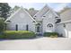 Front view of a home featuring well maintained landscaping, a long drive and an elegant front entrance at 75 Haig Ct., Georgetown, SC 29440