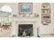 Cozy fireplace with mantel, built-in shelving and access to the dining room at 75 Haig Ct., Georgetown, SC 29440