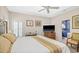 Spacious main bedroom with a ceiling fan, closet, and decorative bedside tables at 75 Haig Ct., Georgetown, SC 29440