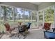 Relaxing screened porch with comfortable seating and scenic views of the surrounding landscape at 75 Haig Ct., Georgetown, SC 29440