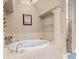 This bathroom has a soaking tub, a decorative column and tile work throughout at 7538 Ventura Ct., Myrtle Beach, SC 29572