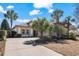 Charming single-story home featuring a well-maintained lawn, tropical palms and a tile roof at 7538 Ventura Ct., Myrtle Beach, SC 29572