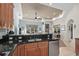 Kitchen with granite countertops, stainless steel appliances, and open layout to the living room at 7538 Ventura Ct., Myrtle Beach, SC 29572