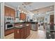 An open kitchen featuring wooden cabinets, stainless steel appliances, and a tiled backsplash at 7538 Ventura Ct., Myrtle Beach, SC 29572