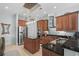 Bright kitchen with stainless steel appliances, granite countertops, and a center island at 7538 Ventura Ct., Myrtle Beach, SC 29572