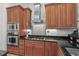 The modern kitchen is equipped with stainless steel appliances and granite countertops at 7538 Ventura Ct., Myrtle Beach, SC 29572