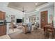 Comfortable living room with a ceiling fan, natural lighting, and neutral tones throughout the interior at 7538 Ventura Ct., Myrtle Beach, SC 29572