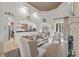 Cozy living room featuring neutral tones, a large window and a view into the kitchen at 7538 Ventura Ct., Myrtle Beach, SC 29572