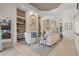 Open-concept living space with a fireplace, built-in shelves and easy access to other rooms at 7538 Ventura Ct., Myrtle Beach, SC 29572