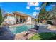 This home boasts a pristine pool and spa surrounded by lush landscaping and outdoor kitchen at 7538 Ventura Ct., Myrtle Beach, SC 29572