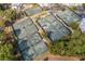 Aerial view of multiple well-maintained tennis courts surrounded by lush landscaping at 7538 Ventura Ct., Myrtle Beach, SC 29572
