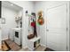 Mudroom with a bench, coat hooks, and access to the laundry room at 781 Flowering Branch Ave., Little River, SC 29566