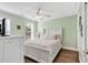 Cozy bedroom with wood floors, bright green walls, and a large window at 885 S Waccamaw Dr., Garden City Beach, SC 29576