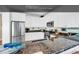 Kitchen featuring granite countertops, stainless steel appliances, and bright white cabinets at 885 S Waccamaw Dr., Garden City Beach, SC 29576