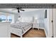 Oceanfront Main Bedroom Suite featuring wood floors, white furniture, and lots of light at 885 S Waccamaw Dr., Garden City Beach, SC 29576