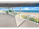 Expansive oceanfront deck featuring white railings and views of the beach and ocean at 885 S Waccamaw Dr., Garden City Beach, SC 29576