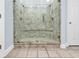 Tiled walk-in shower featuring dual shower heads and glass doors at 885 S Waccamaw Dr., Garden City Beach, SC 29576