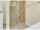 Shower features glass door, tiled walls, and a convenient built-in shelf at 885 S Waccamaw Dr., Garden City Beach, SC 29576