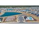 Panoramic aerial view of a vibrant community with a resort-style pool and a tranquil pond at 892 Harrison Mill St., Myrtle Beach, SC 29579