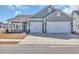 Charming home with a two-car garage, blue siding, and manicured landscaping at 892 Harrison Mill St., Myrtle Beach, SC 29579