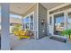 Inviting front porch with ample seating and a charming welcome sign at 892 Harrison Mill St., Myrtle Beach, SC 29579