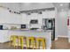 Modern kitchen featuring a large island with seating, stainless steel appliances, and granite countertops at 892 Harrison Mill St., Myrtle Beach, SC 29579