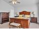 Spacious bedroom suite with dark wood furniture and neutral decor at 892 Harrison Mill St., Myrtle Beach, SC 29579