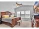 Bright bedroom featuring large windows, a ceiling fan, and neutral colors at 892 Harrison Mill St., Myrtle Beach, SC 29579