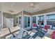 Inviting screened-in porch with ceiling fans and comfortable seating area at 892 Harrison Mill St., Myrtle Beach, SC 29579