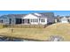Large backyard with iron fence, screened porch, and beautiful landscaping at 9035 Binnicker Dr., Murrells Inlet, SC 29576