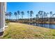 Backyard with an iron fence and a pond at 9035 Binnicker Dr., Murrells Inlet, SC 29576