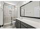 Bathroom features large walk-in shower, gray vanity, granite countertop, sleek mirror, and tile flooring at 9035 Binnicker Dr., Murrells Inlet, SC 29576