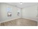 Light-filled bedroom with hardwood flooring and views of the neighborhood at 9035 Binnicker Dr., Murrells Inlet, SC 29576
