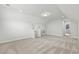Spacious bonus room with neutral carpeting, light walls, and access to a brightly lit room at 9035 Binnicker Dr., Murrells Inlet, SC 29576