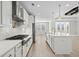 Spacious kitchen with an island, stainless appliances, and white cabinets offering a modern feel at 9035 Binnicker Dr., Murrells Inlet, SC 29576