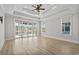 Large main bedroom with views of the pond and backyard from the sliding glass doors and window at 9035 Binnicker Dr., Murrells Inlet, SC 29576