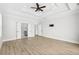 Spacious main bedroom with a tray ceiling, ceiling fan, and access to the main bath at 9035 Binnicker Dr., Murrells Inlet, SC 29576