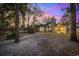 Backyard view of house featuring a stone pathway leading to a patio with outdoor seating at 954 Oakwood Ln., Myrtle Beach, SC 29572