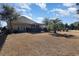 Fenced backyard with mature landscaping, an outdoor patio area, and a brick home exterior at 9800 Plumfield Ct., Myrtle Beach, SC 29579