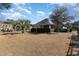 Large backyard with professional landscaping, privacy fencing, and a covered patio space at 9800 Plumfield Ct., Myrtle Beach, SC 29579