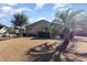 Landscaped backyard showcasing the home's exterior and fencing for added privacy at 9800 Plumfield Ct., Myrtle Beach, SC 29579