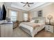 Bedroom with a white and beige color scheme, plush carpet, and ample natural light at 9800 Plumfield Ct., Myrtle Beach, SC 29579
