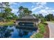 Community entrance with Plantation Lakes signage, waterfall feature, and lush landscaping at 9800 Plumfield Ct., Myrtle Beach, SC 29579