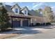 Brick home with a two car garage with a pergola detail and a wide driveway at 9800 Plumfield Ct., Myrtle Beach, SC 29579